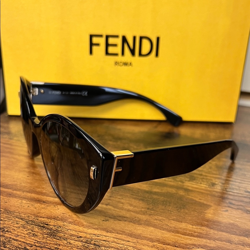 Fendi Elegant Black Sunglasses with Gold Accents